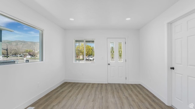 557 N 1200 W, Salt Lake City, UT 84116 - unfurnished room with baseboards, wood finished floors, and recessed lighting