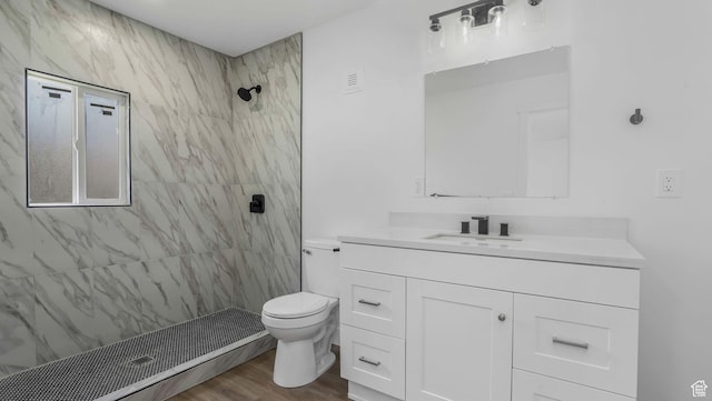 557 N 1200 W, Salt Lake City, UT 84116 - bathroom with tiled shower, wood finished floors, vanity, and toilet