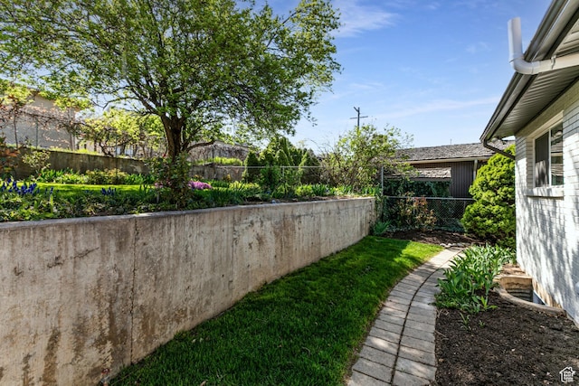 view of yard with a fenced backyard
