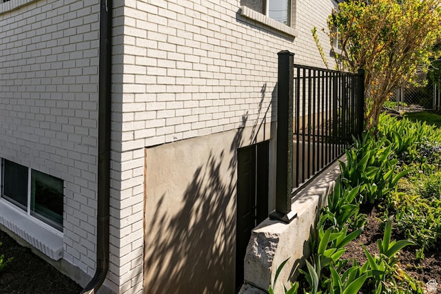 view of side of property featuring brick siding