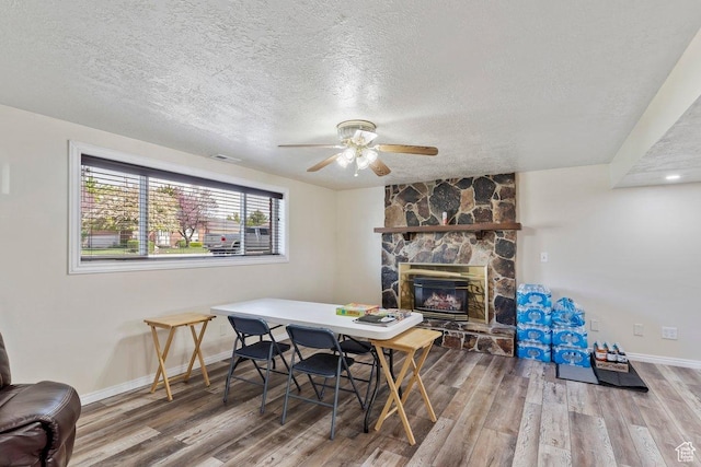 1971 N 3060 W, Clinton, UT 84015 - dining room with baseboards, wood finished floors, and a textured ceiling
