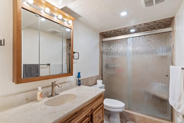 1971 N 3060 W, Clinton, UT 84015 - full bathroom with a shower stall, visible vents, toilet, and vanity