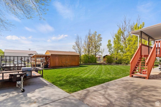 1971 N 3060 W, Clinton, UT 84015 - view of yard featuring stairway, an outdoor structure, fence, a patio, and a storage unit