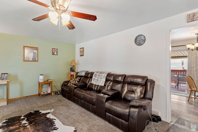 1971 N 3060 W, Clinton, UT 84015 - carpeted living room with ceiling fan with notable chandelier and baseboards