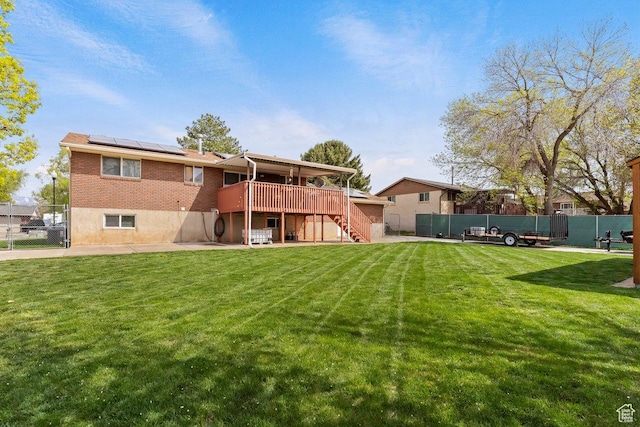 1971 N 3060 W, Clinton, UT 84015 - back of property featuring a deck, fence, a yard, solar panels, and stairs