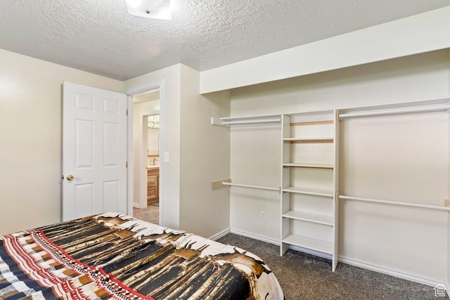 1971 N 3060 W, Clinton, UT 84015 - carpeted bedroom featuring a closet, a textured ceiling, and baseboards