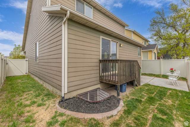 2526 S Andover St, West Haven, UT 84401 - view of side of home with a lawn, a fenced backyard, a gate, and a patio