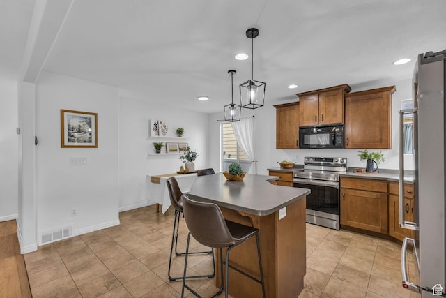 2526 S Andover St, West Haven, UT 84401 - kitchen featuring brown cabinetry, stainless steel electric range, black microwave, a breakfast bar area, and visible vents