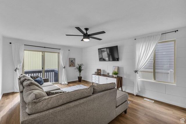 2526 S Andover St, West Haven, UT 84401 - living room with wood finished floors, visible vents, a ceiling fan, and baseboards