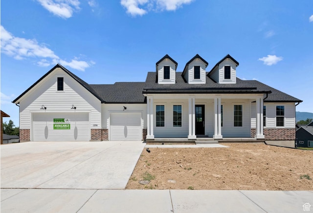 1256 W 800 S # 12, Spanish Fork, UT 84660 - modern inspired farmhouse featuring brick siding, a garage, driveway, and covered porch