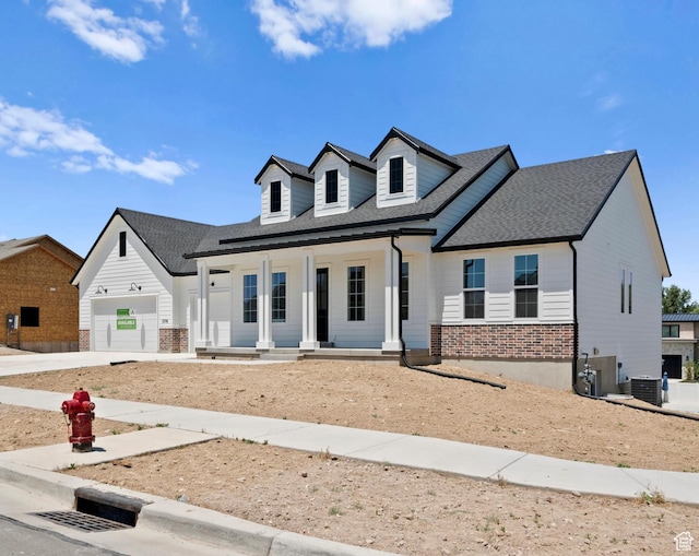 1256 W 800 S # 12, Spanish Fork, UT 84660 - modern farmhouse with a porch, brick siding, roof with shingles, driveway, and a garage
