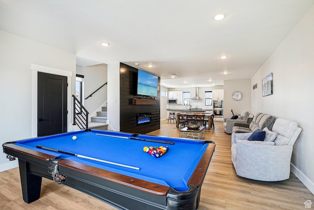 1152 Gambel Oak Way, Park City, UT 84098 - rec room with recessed lighting, billiards, baseboards, a fireplace, and light wood-style flooring