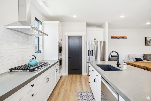 1152 Gambel Oak Way, Park City, UT 84098 - kitchen with a sink, wall chimney exhaust hood, decorative backsplash, appliances with stainless steel finishes, and open floor plan