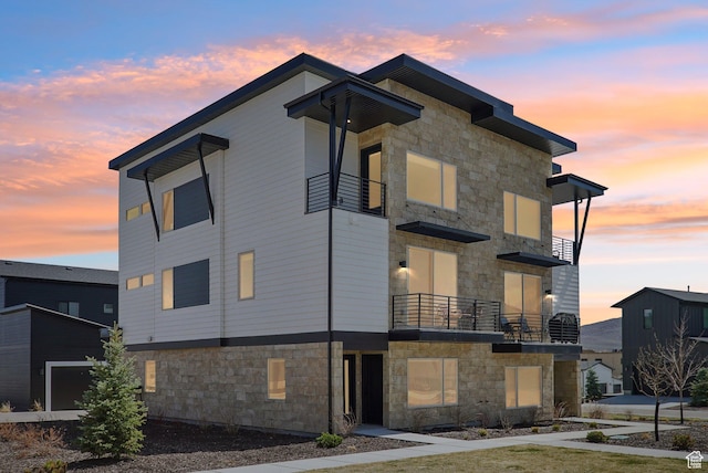 1152 Gambel Oak Way, Park City, UT 84098 - property exterior at dusk featuring stone siding and a balcony