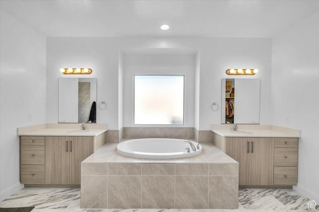 1519 E Honeycomb Dr S, St George, UT 84790 - full bathroom with a garden tub, two vanities, and baseboards