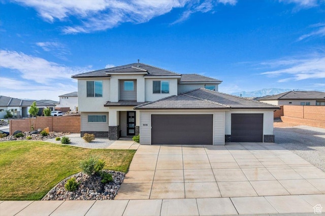 1519 E Honeycomb Dr S, St George, UT 84790 - prairie-style house with an attached garage, concrete driveway, stucco siding, and stone siding