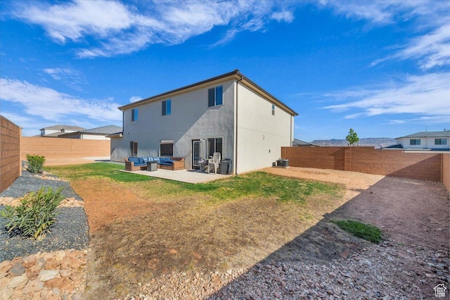 1519 E Honeycomb Dr S, St George, UT 84790 - rear view of house with an outdoor hangout area, a fenced backyard, central AC, and a patio