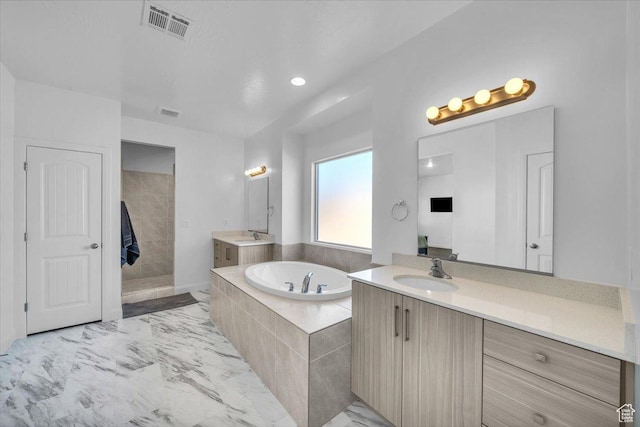 1519 E Honeycomb Dr S, St George, UT 84790 - full bathroom featuring a garden tub, two vanities, marble finish flooring, and recessed lighting