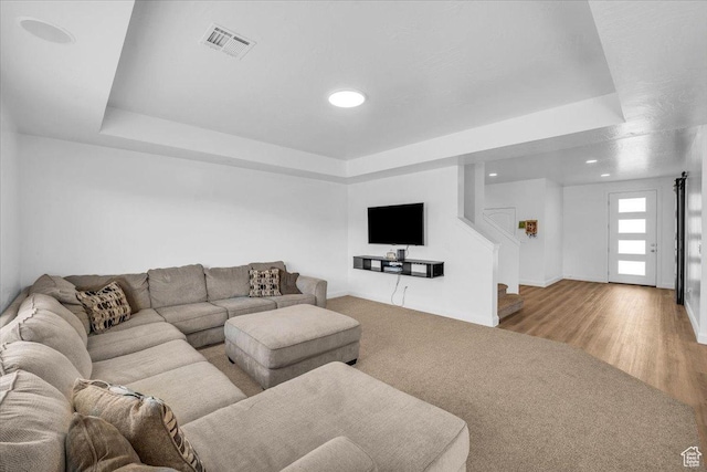 1519 E Honeycomb Dr S, St George, UT 84790 - carpeted living area with a tray ceiling, recessed lighting, stairway, and wood finished floors