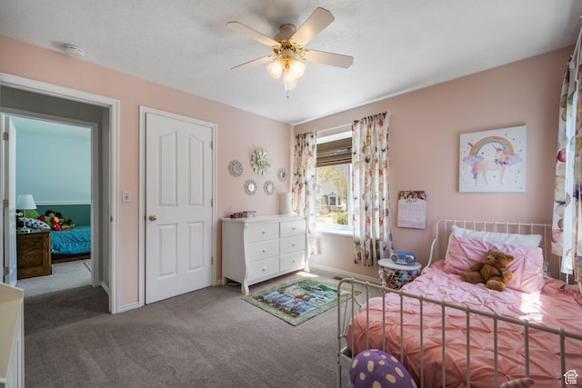bedroom with carpet flooring, baseboards, and ceiling fan