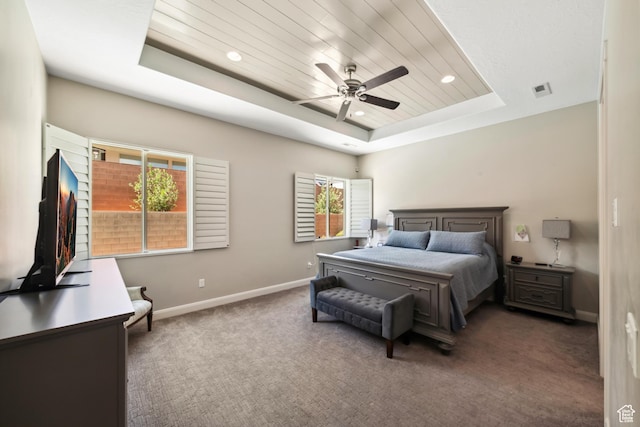bedroom featuring recessed lighting, a raised ceiling, visible vents, baseboards, and carpet flooring