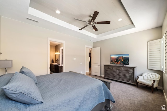 bedroom with recessed lighting, a raised ceiling, visible vents, baseboards, and carpet flooring