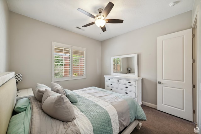 bedroom with ceiling fan, carpet floors, visible vents, and baseboards