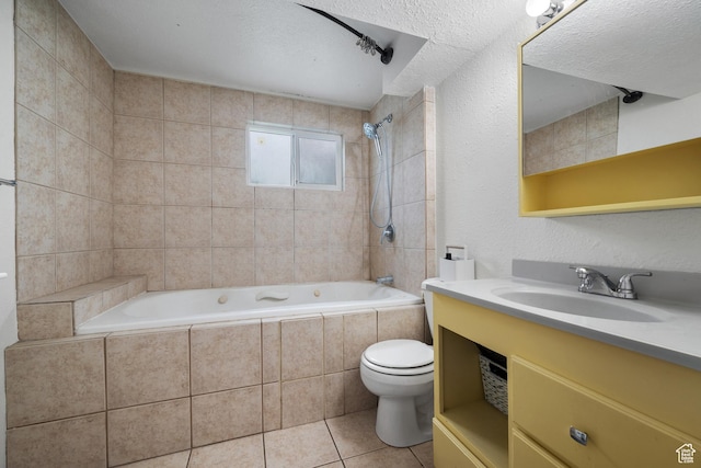 bathroom featuring vanity, tile patterned flooring, tiled shower / bath, and toilet
