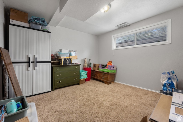 game room with baseboards, visible vents, and light colored carpet