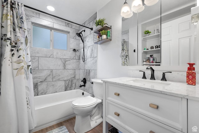 bathroom featuring wood finished floors, toilet, vanity, and shower / bath combination with curtain