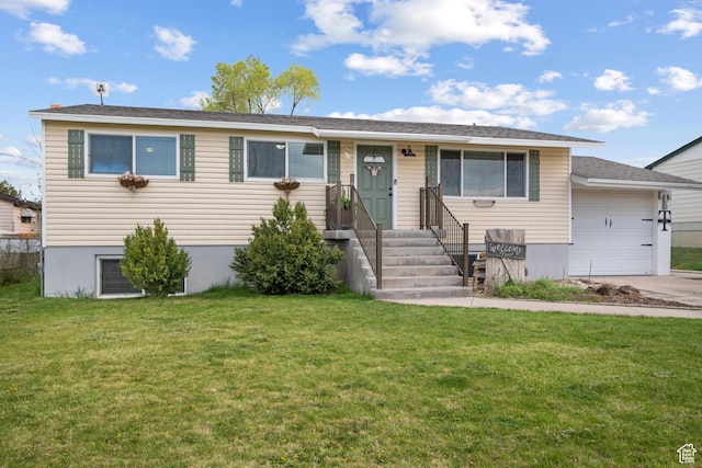 view of front facade featuring a front lawn, driveway, and a garage