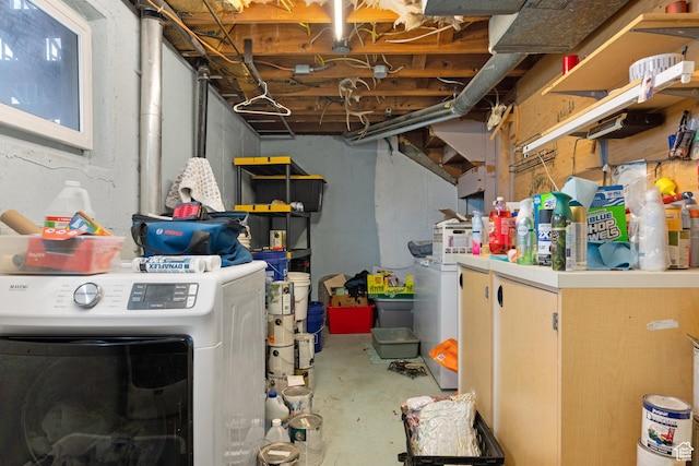 unfinished basement with washer / clothes dryer