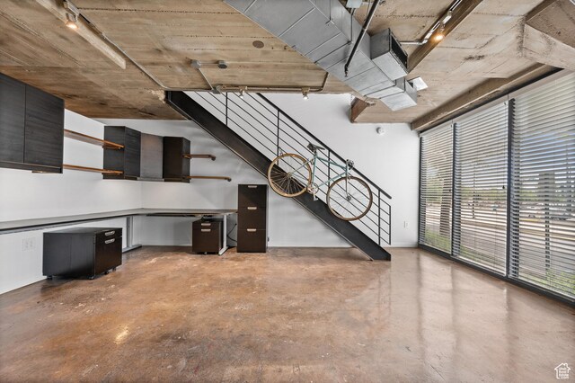 380 W 200 S Unit 104, Salt Lake City, UT 84101 - interior space featuring track lighting, baseboards, and stairway