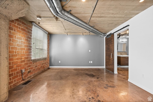 380 W 200 S Unit 104, Salt Lake City, UT 84101 - basement with baseboards and visible vents
