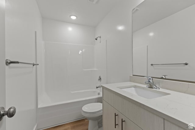 3374 S 1010 W, Nibley, UT 84321 - bathroom with toilet, vanity, wood finished floors, and shower / bathing tub combination