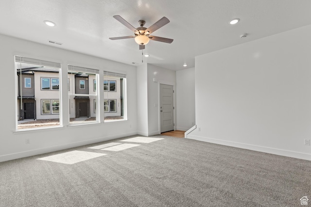 3374 S 1010 W, Nibley, UT 84321 - empty room featuring visible vents, carpet flooring, baseboards, and ceiling fan