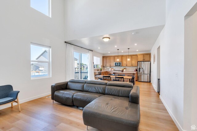 1167 S 1275 W, Clearfield, UT 84015 - living room with recessed lighting, light wood finished floors, and baseboards