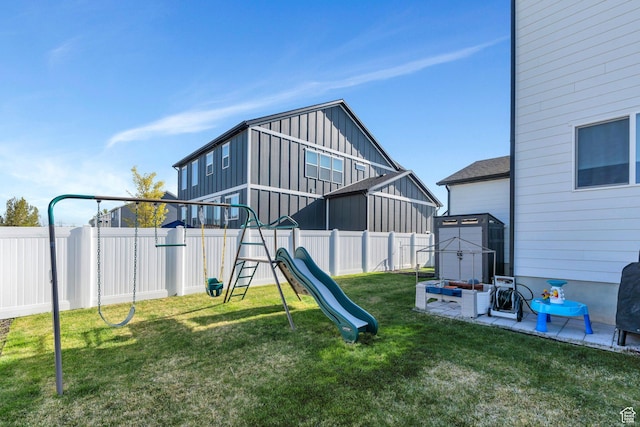 1167 S 1275 W, Clearfield, UT 84015 - view of playground with a fenced backyard and a lawn