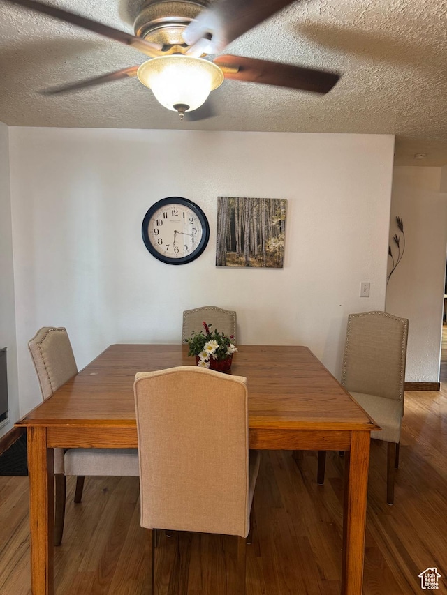 75 S Cooley St W, Grantsville, UT 84029 - dining area with a ceiling fan, wood finished floors, and a textured ceiling
