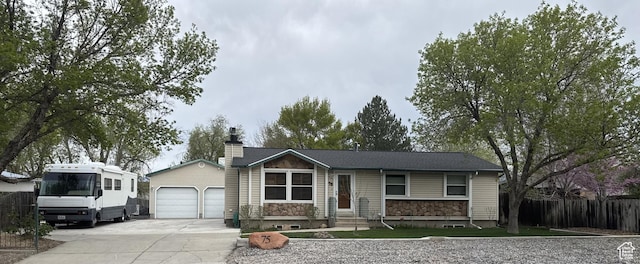 75 S Cooley St W, Grantsville, UT 84029 - single story home featuring driveway, stone siding, a chimney, fence, and entry steps