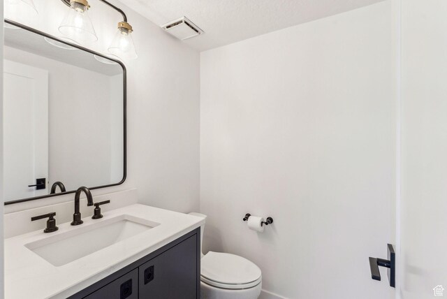4824 N Meadow Loop Rd Unit 7, Park City, UT 84098 - bathroom featuring visible vents, toilet, and vanity