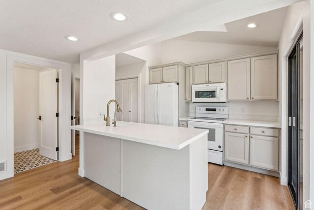4824 N Meadow Loop Rd Unit 7, Park City, UT 84098 - kitchen with vaulted ceiling, a sink, white appliances, light countertops, and recessed lighting