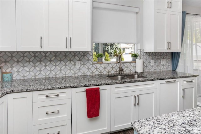 364 W Clark Cir, Farmington, UT 84025 - kitchen with a sink, white cabinets, decorative backsplash, and light stone counters