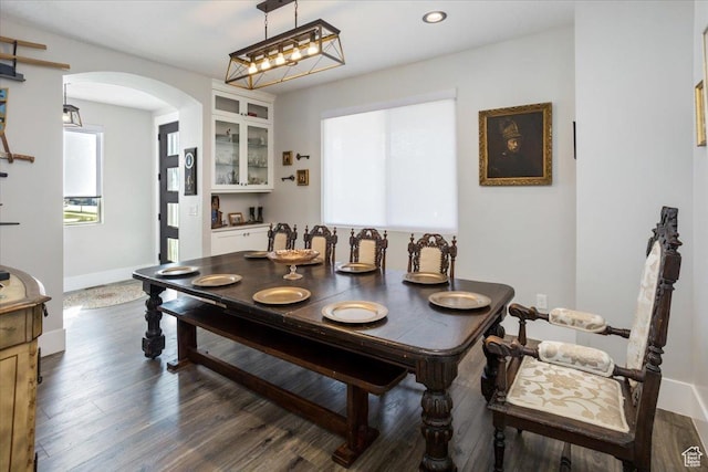 364 W Clark Cir, Farmington, UT 84025 - dining space featuring arched walkways, dark wood-style flooring, baseboards, and recessed lighting