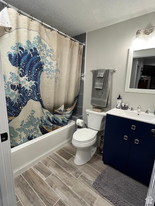 364 W Clark Cir, Farmington, UT 84025 - bathroom with a textured ceiling, shower / bathtub combination with curtain, vanity, toilet, and wood finished floors