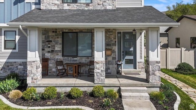 364 W Clark Cir, Farmington, UT 84025 - view of exterior entry with stone siding, covered porch, and board and batten siding