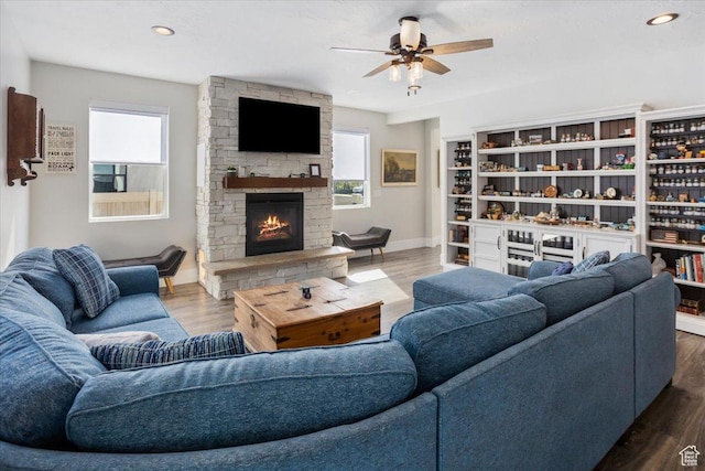 364 W Clark Cir, Farmington, UT 84025 - living room featuring a ceiling fan, a fireplace, baseboards, wood finished floors, and recessed lighting