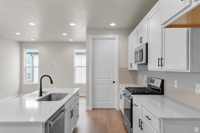 3903 W Red Clover Dr, Lehi, UT 84043 - kitchen featuring recessed lighting, appliances with stainless steel finishes, a sink, and light wood-style floors