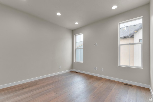 3903 W Red Clover Dr, Lehi, UT 84043 - spare room featuring light wood finished floors, baseboards, visible vents, and recessed lighting