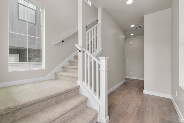 3903 W Red Clover Dr, Lehi, UT 84043 - stairs featuring baseboards, wood finished floors, visible vents, and recessed lighting